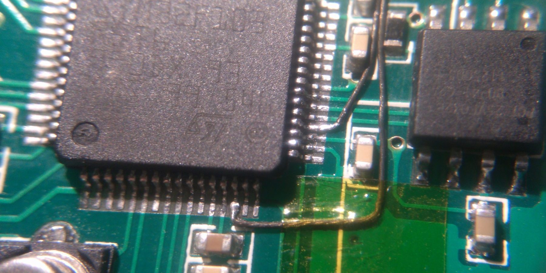 Both pins after wires are soldered onto them.